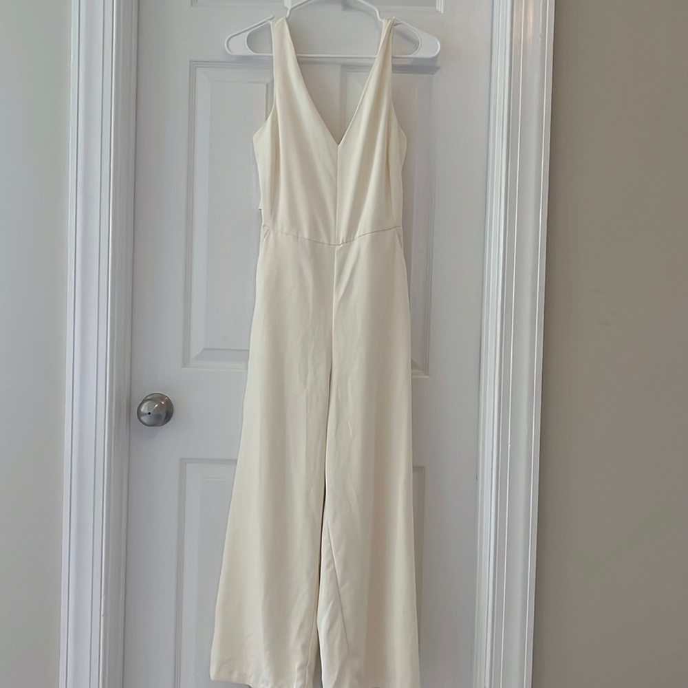 Cream colored bow jumper size small